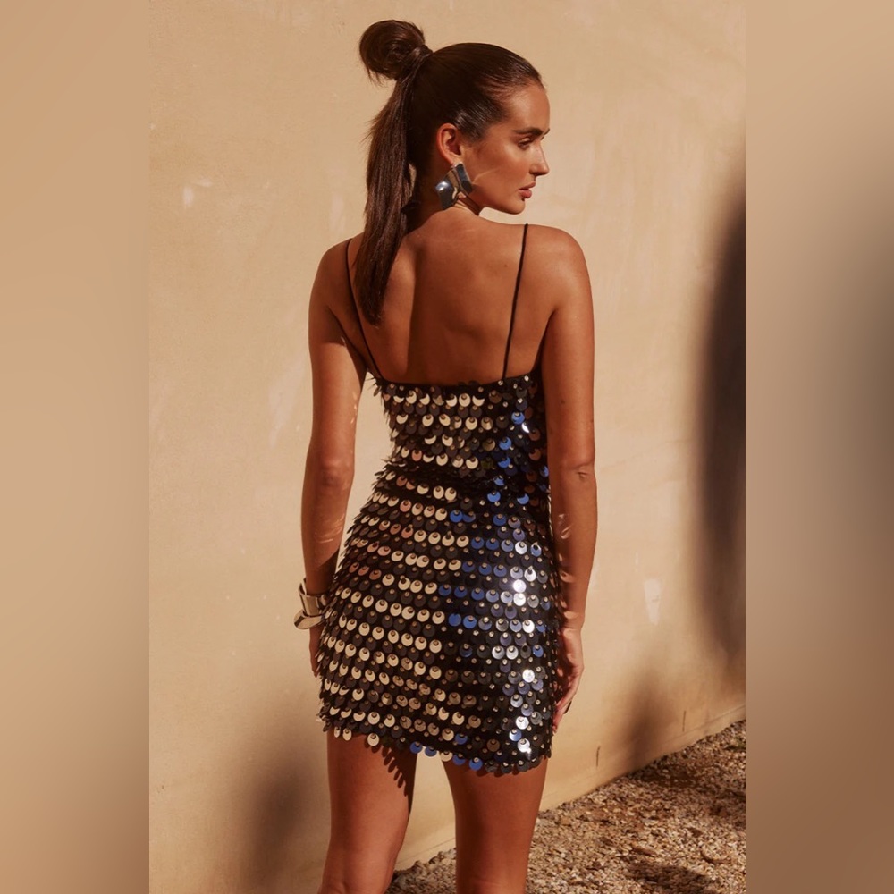 New with tags Beautiful sequin black dress with silver detailing.